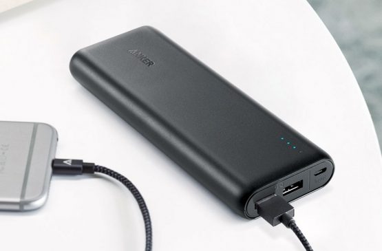 a black portable charger lying on the table