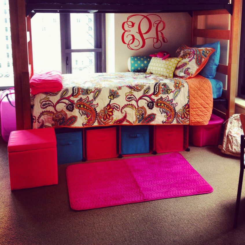 a college student dorm bed decorated with vibrant colored objects