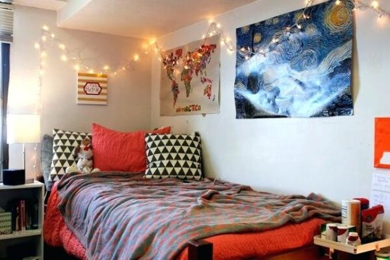 a cute college dorm room decorated with lights