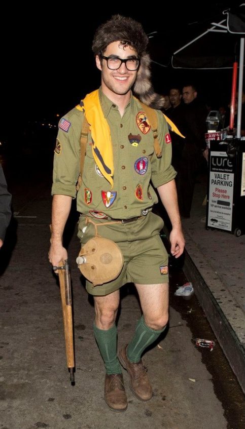a guy wearing a boy scout costume