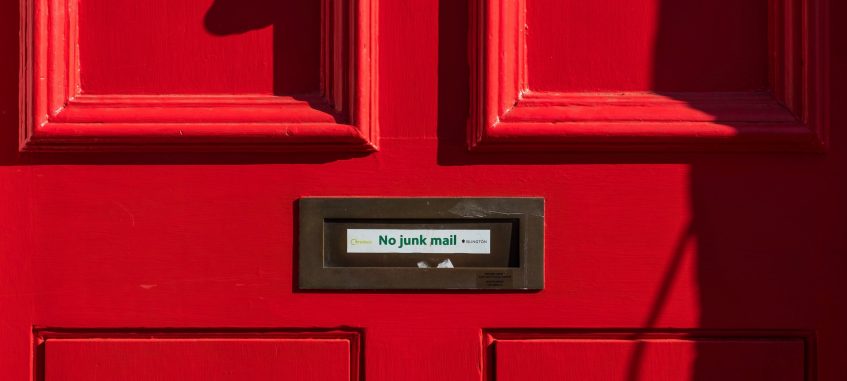 a letter hole in the red door