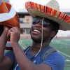 a man wearing sombrero on the background of football field