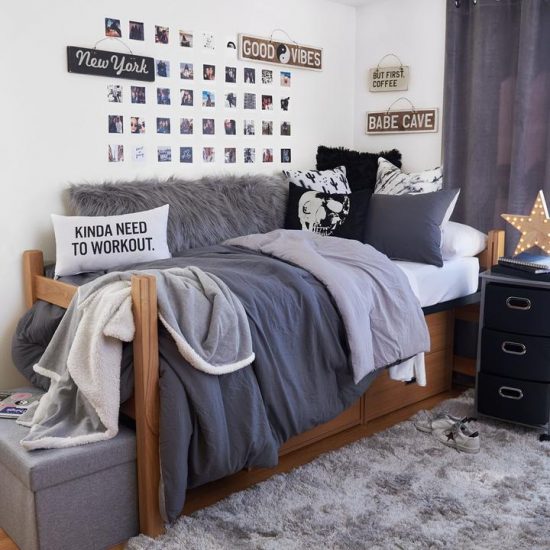 a student dorm room decorated in monochrome colors