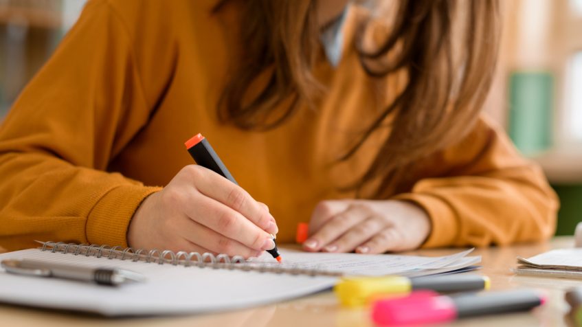 A student making notes