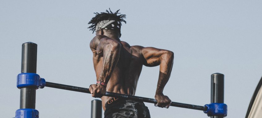 a young man is doing outdoor workout