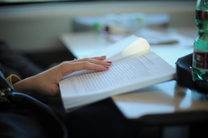 woman holding an opened book