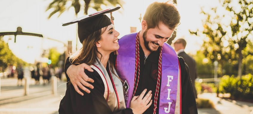 graduate couple in college