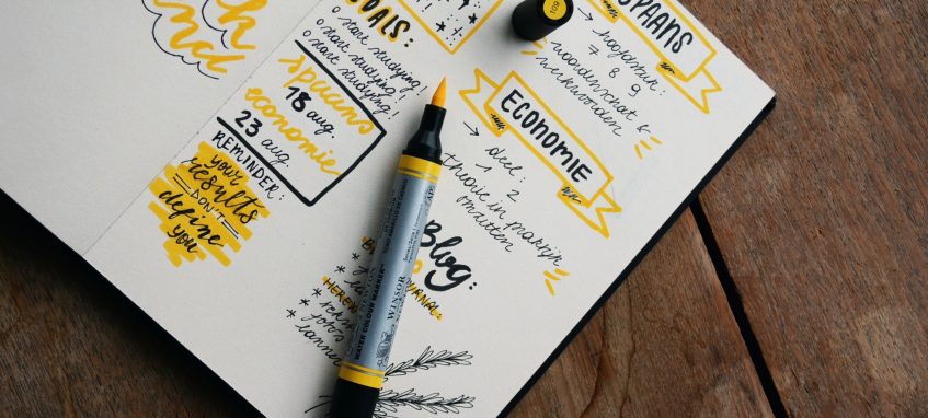 black and yellow doodles in the notebook