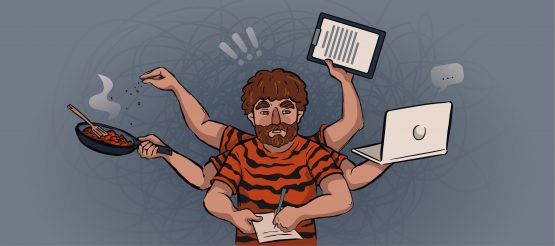 a guy in a tiger shirt holds a laptop, a pan and papers in his hands