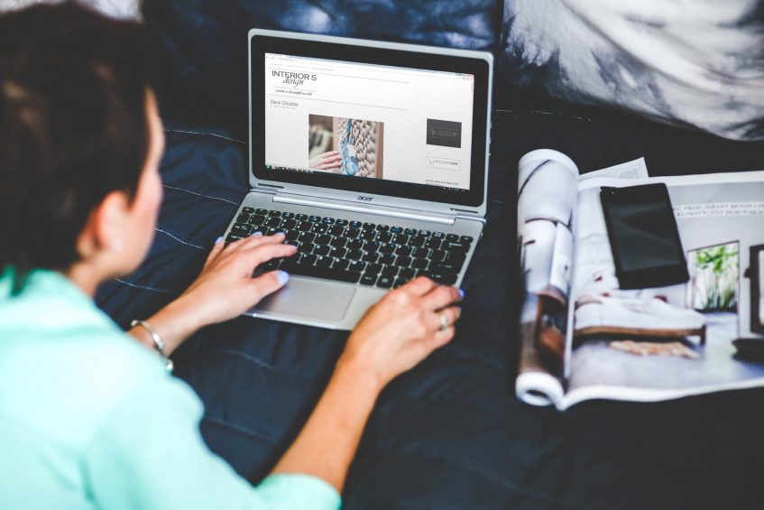 woman typing on laptop