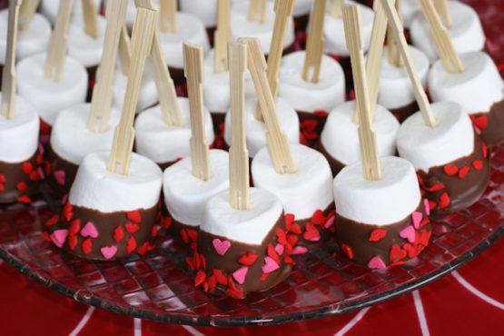 marshmellows coverd with chocolate on the sticks