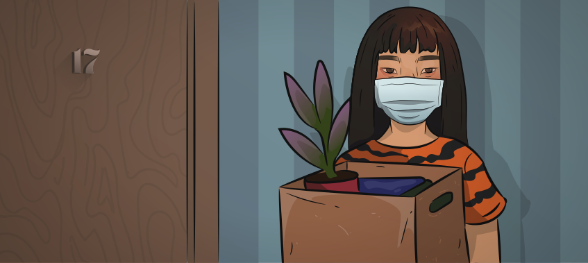 a girl in a tiger shirt and mask in standing with a box full of her belongings