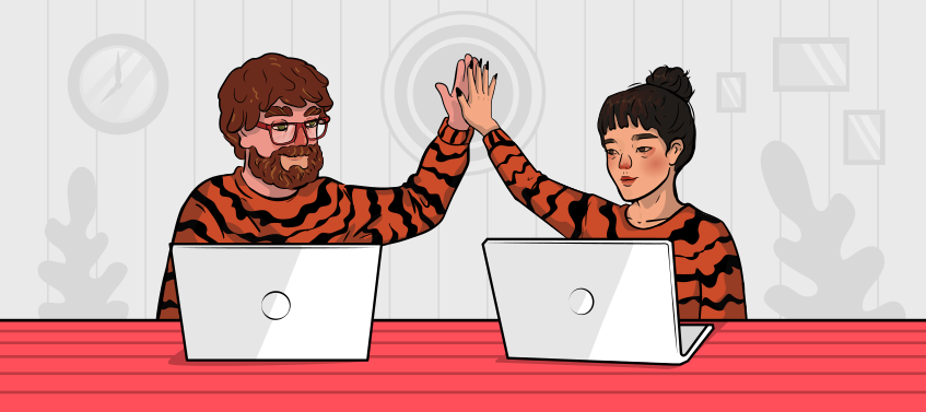 a girl and a guy in tiger shirts are gicing each other high fives