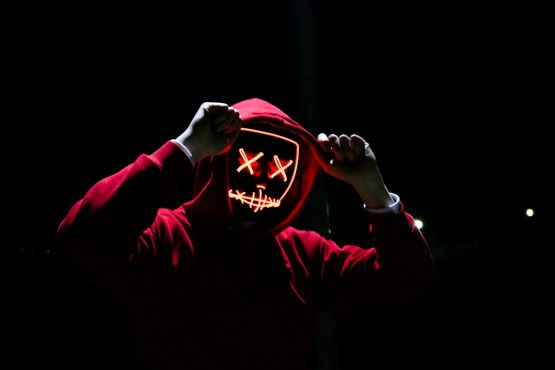 a guy in a glowing mask