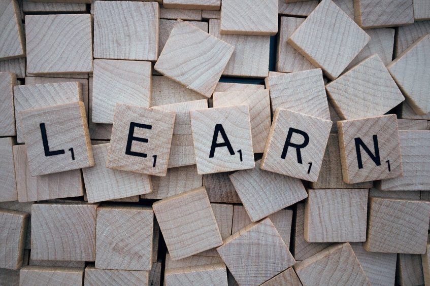 a word learn created from wooden bricks with letters