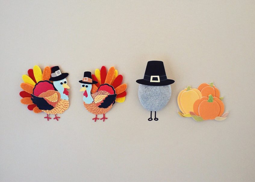 handmade turkeys, pumpkins and a stone in a hat