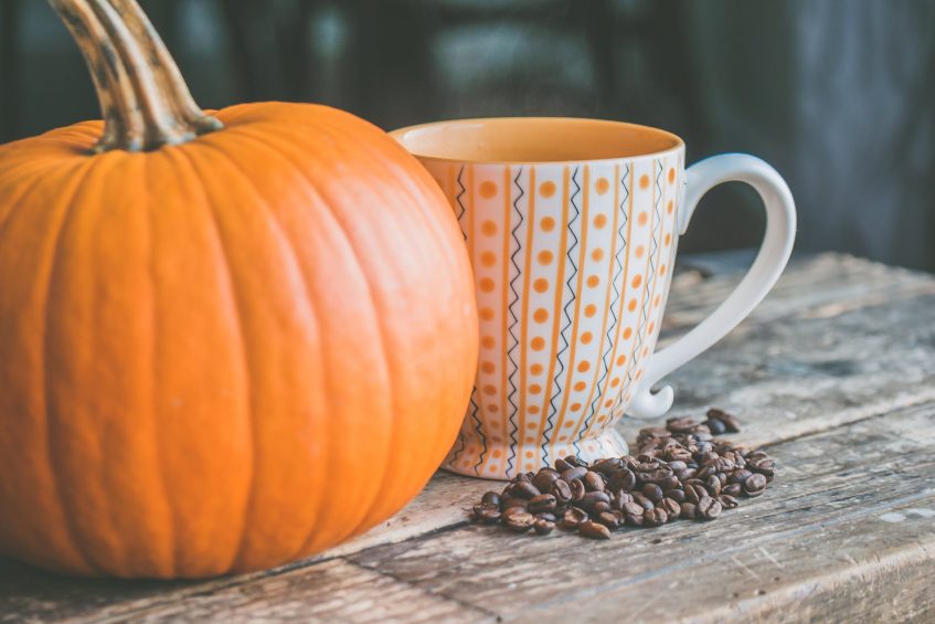 a pumpking and a cup