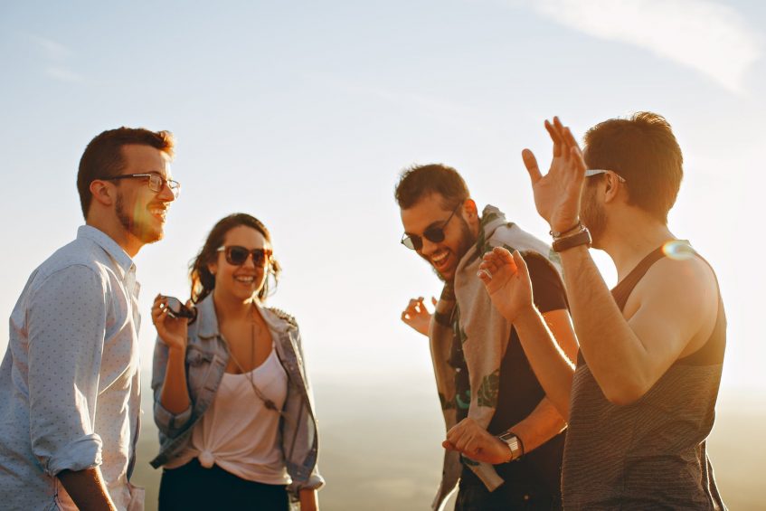 four friends laughing