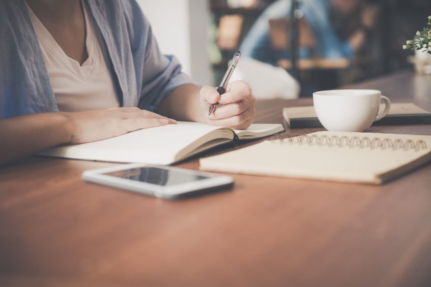 girl writing in a diary