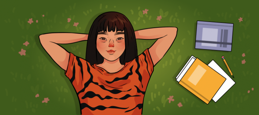 a girl in a tiger shirt is lying in grass