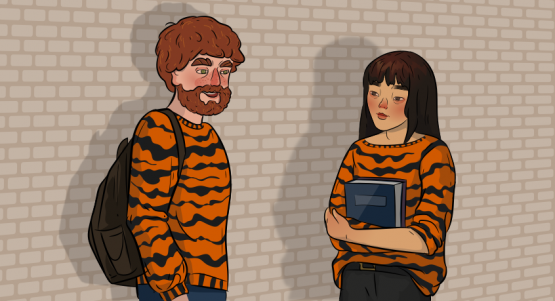 a girl in a tiger sweater is talking to a guy in a tigerr sweater