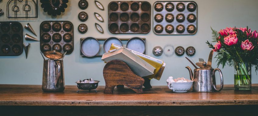 various kitchen appliances on the wooden table