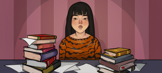 a girl in a tiger sweater is sitting at the table with lots of books