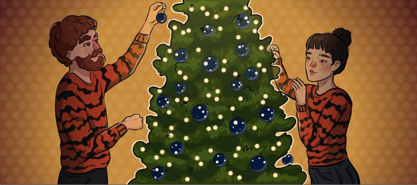 a girl and a boy in tiger sweaters are decorating christmas tree